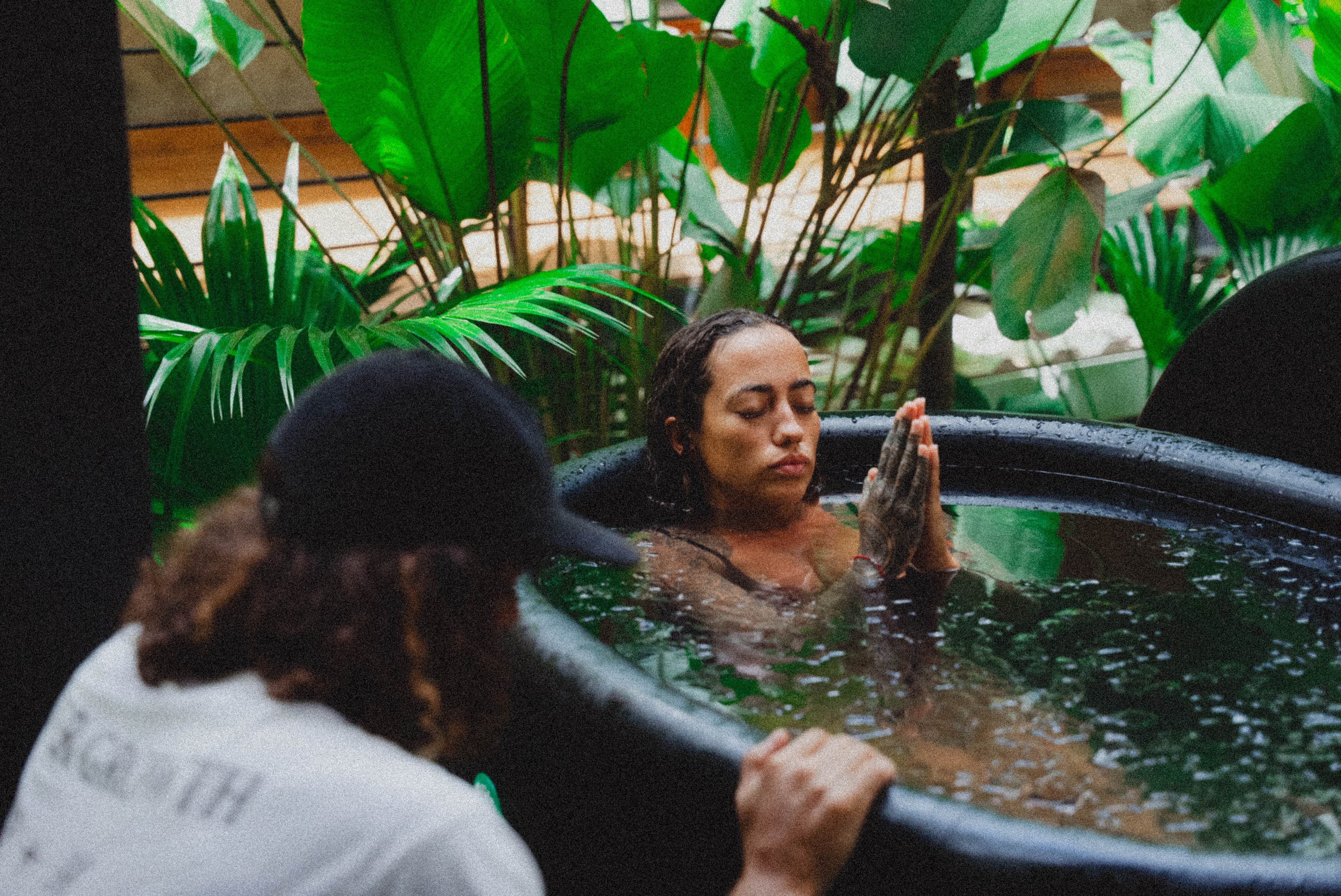 Guest in the cold plunge, eyes closed